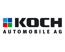 Logo der Koch Automobile AG mit vier farbigen Quadraten (blau, grün, rot und grau) auf der linken Seite, gefolgt von dem fetten schwarzen Text KOCH und dem kleineren schwarzen Text AUTOMOBILE AG, darunter stolze Unterstützer des Handballs in Brandenburg.